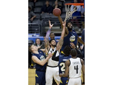 Anthony Stover of the St. John's Edge beats the London Lightning's Julian Boyd to a rebound during Game 1 of their National Basketball League of Canada best-of-seven Central Division final Tuesday at Budweiser Gardens. Derek Ruttan/The London Free Press