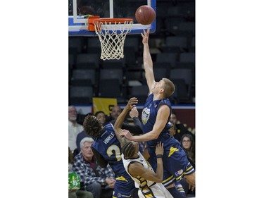 Wally Ellenson of the St. John's Edge scores over Marcus Capers of the London Lightning during Game 1 of their National Basketball League of Canada best-of-seven Central Division final Tuesday at Budweiser Gardens. Derek Ruttan/The London Free Press