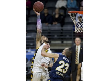 Julian Boyd of the London Lightning shoots while being covered by Carl English of the St. John's Edge during Game 1 of their National Basketball League of Canada best-of-seven Central Division final Tuesday at Budweiser Gardens. Derek Ruttan/The London Free Press