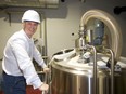 Brian Semkowski, president of Equals Brewery Company Inc., shows off some new hardware at their new facility on Sovereign Road. (Mike Hensen/The London Free Press)
