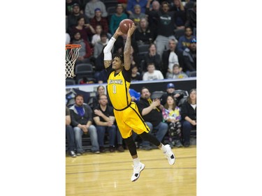 Mol Bolden of the London Lightning makes a flying slam dunk against the St. John's Edge during their NBL playoff game in London on Thursday. Derek Ruttan/The London Free Press