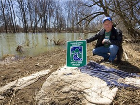 Todd Sleeper, who started the Friends of the Thames, shows some of the garbage found along the Thames banks in London, Ont. (MIKE HENSEN/The London Free Press)