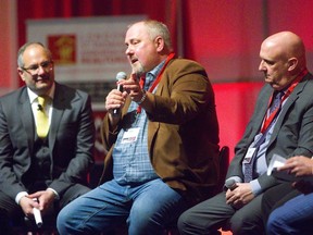 While moderator Matthew Ferrara, left, listens, St. Thomas homebuilder Doug Tarry participates in a panel discussion Monday at the Economic and Smart Technology Summit at the London Convention Centre..  
Mike Hensen/The London Free Press
