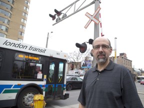 Edward Soldo, the city's director of transportation shown here at the CP Rail crossing at Richmond Street, says, "We're looking to get a better understanding of when the trains are coming, and how long are the delay." Derek Ruttan/The London Free Press