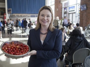 Middlesex London Food Policy Council member Tosha Densky with some of the food being served at the council's annual general meeting at Covent Garden Market in London. (DEREK RUTTAN, The London Free Press)