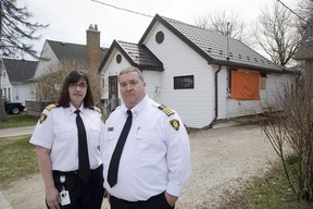 Acting fire chief Lori Hamer and deputy chief Jack Burt say four of the last five fire deaths in London were caused by contraband cigarettes. While not fatal, a fire at 95 St. Julien (behind them) this week was caused by a contraband cigarette. (Derek Ruttan/The London Free Press)