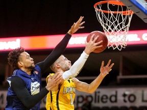 Garrett Williamson of the London Lightning drives inside Charles Hinkle of the St. John's Edge during their National Basketball League semifinal Sunday, April 29 at Budweiser Gardens. The Lightning won 106-101, to take the best-of-seven series 4-2. Williamson led the team with 25 points, 10 rebounds and 7 assists. The Lightning face the Halifax Hurricanes for the NBL championship. Mike Hensen/The London Free Press