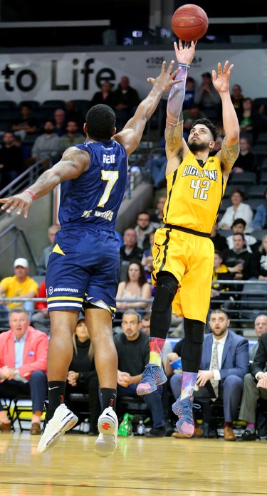 Julian Boyd of the Lightning takes a shot against Ryan Reid of the St. John's Edge as the Lightning won 106-101 in a hard fought battle at Budweiser Gardens on Sunday April 29, 2018. The Lightning won the series 4-2 and will now face Halifax for the NBL championship. Mike Hensen/The London Free Press/Postmedia Networki