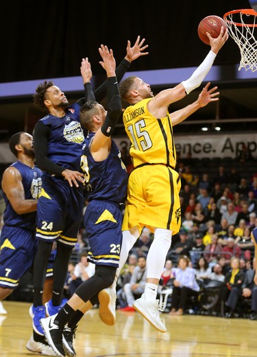 Garrett Williamson of the Lightning drives to the hoop past Ryan Reid, Charles Hinkle and Carl English of the St. John's Edge as the Lightning won 106-101 in a hard fought battle at Budweiser Gardens on Sunday April 29, 2018. Williamson led the team with 25 points mostly on hard slashes to the net along with 10 rebounds and 7 assists. The Lightning won the series 4-2 and will now face Halifax for the NBL championship. Mike Hensen/The London Free Press/Postmedia Network