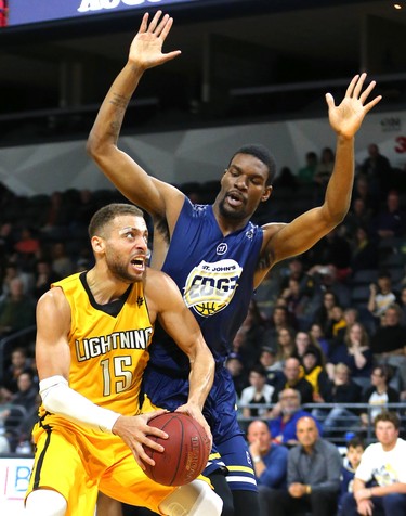 Garrett Williamson of the Lightning drives on Xavier Ford of the St. John's Edge as the Lightning won 106-101 in a hard fought battle at Budweiser Gardens on Sunday April 29, 2018. Williamson led the team with 25 points mostly on hard slashes to the net along with 10 rebounds and 7 assists. The Lightning won the series 4-2 and will now face Halifax for the NBL championship. Mike Hensen/The London Free Press/Postmedia Network