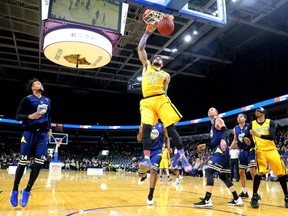 Julian Boyd of the Lightning gets a big dunk late in the game against the St. John's Edge Sunday, April 29 at Budweiser Gardens. The Lightning won 106-101, to take the best-of-seven semifinal series 4-2. The Lightning face the Halifax Hurricanes for the NBL championship. Mike Hensen/The London Free Press