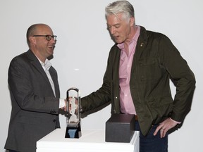 Mayor Matt Brown accepts the Host City Juno from Allan Reid, President and CEO of the Canadian Academy of Recording Arts and Sciences, The Juno Awards and MusiCounts in London, Ont. on Monday April 30, 2018. London will host the 2019 Juno Awards.Derek Ruttan/The London Free Press/Postmedia Network