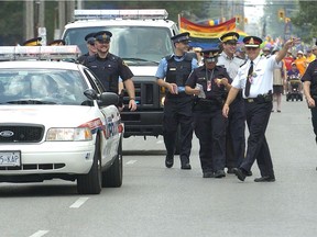 London Police had their vehicles decorated with the colours of the rainbow flag as their officers participated in the 17th annual Pride London Festival parade for the first time on July 24, 2011 in London. (Free Press file photo)