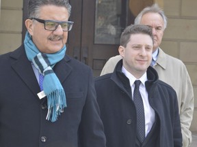 Mark Phillips, right, was given a conditional discharge after he plead guilty to attacking an immigrant family in a St. Thomas parking lot with a baseball bat last December. Phillips will have to complete 240 hours of community service and is subject to three years of probation. 
LOUIS PIN, Postmedia News