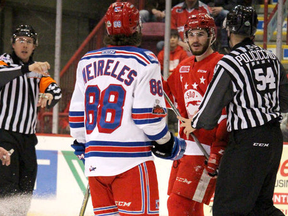Soo Greyhounds player Noah Carrikk shares words with Kitchener Rangers opponent Greg Meireles during the first period of Game 2 of the Western Conference final at Essar Centre in Sault Ste. Marie, Ont., on Saturday, April 21, 2018. (BRIAN KELLY/THE SAULT STAR)