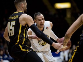 London Lightning’s Garrett Williamson, left, looks to contain an intense St. John’s Edge attacker in the first half of Game 4 of the National Basketball League of Canada Central Division final in St. John’s, N.L., Monday night. St. John’s won 123-110 to knot the best-of-seven series at two games apiece. (St. John's Edge/Jeff Parsons)