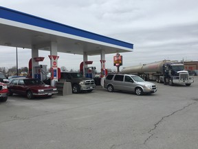 Gas prices in St. Thomas were the lowest in the province for the second day in a row Tuesday. Cars lined Talbot Street for a chance to take advantage of the discount prices at the Mobil and Pioneer stations. (Laura Broadley/Times-Journal)