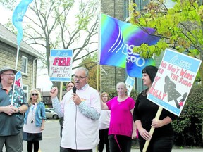 Warren (Smokey) Thomas, centre, president of the Ontario Public Service Employees Union, speaks with picketers last October outside the Elgin County branch of the Canadian Mental Health Association. The South West Local Health Integration Network launched an investigation into complaints of a toxic work environment at CMHA Elgin. The LHIN recently released a report by a third-party investigator and will appoint a supervisor to CMHA Elgin. (File photo)