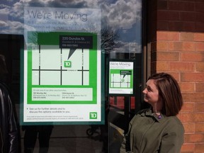 The Old East Village Community Association's Joel Eckert, left, and Meg Pirie stand outside the doomed TD Branch at Dundas and Lyle streets. When it closes in August, the Old East Village will be left with no active branch of any brand of bank. (DAN BROWN, The London Free Press)