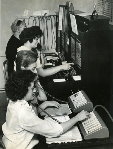 University of Western Ontario's new Centrex telephone system, 1966. Shown from rear are Mrs. F.R. Somerville, Mrs. Greta Bain, mrs. G.S. Minniss and Mrs. H.W. Chambers.  (London Free Press files)