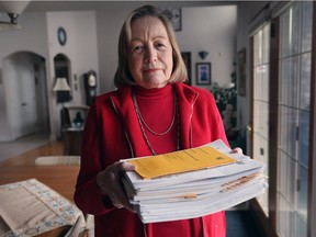 Gay Viecelli is photographed at her Windsor home displaying a stack of documents related to her issues with Tarion, a company that regulates new builders and provides warranties for new homes.