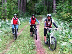 Enjoying the off-road trails are (from left) Jenna Hunter, Natasha Borutski and ride guide Sara Archer. (Barbara Fox photo)