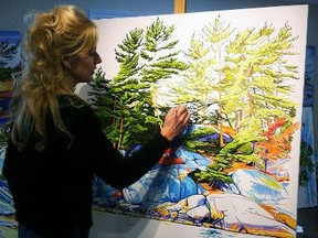 Margarethe Vanderpas works on one of her paintings in her studio in Stratford. As part of the 2018 Stratford Studio Tour, Vanderpas and 18 other Stratford artists will display their work at studios and other venues through the city’s downtown Saturday through Monday.