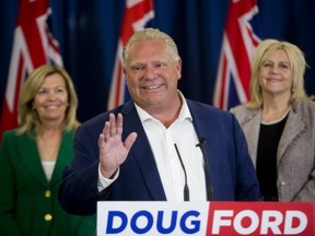Ontario PC leader Doug Ford announces that his party will always respect veterans, soldiers and police during a press conference at the London Convention Centre in London, Ont. on Thursday May 31, 2018. He is flanked by Newmarket-Aurora candidate Christine Elliott (left) and London-North-Centre candidate Susan Truppe. Derek Ruttan/The London Free Press