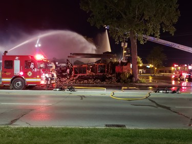 Firefighters still on scene at Hooks restaurant at midnight Tuesday. (London Free Press photo)