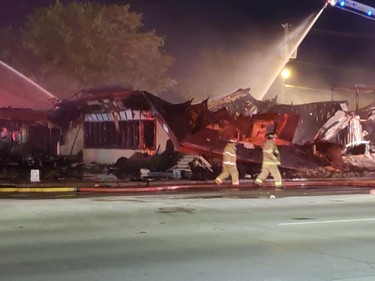 Firefighters still on scene at Hooks restaurant at midnight Tuesday. (London Free Press photo)