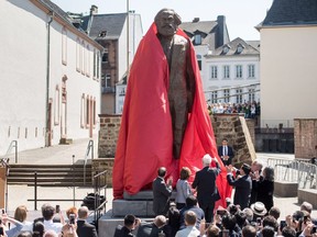 A sculpture of German philosopher and revolutionary Karl Marx is unveiled in Trier, Germany, May 5, the 200th anniversary of Marx’s birth.