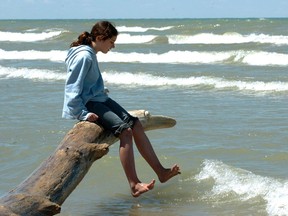 Alexandria Gillett tests the water at the beach at Pinery Provincial Park. (File photo)
