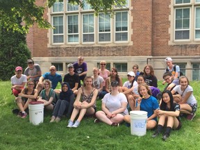 Students from Central secondary school and the Forest City Program enjoy popsicles after walking through downtown London with two buckets of water. They were raising awareness about the scarcity of clean drinking water in developing countries. (SHALU MEHTA/THE LONDON FREE PRESS)