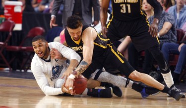 Ryan Anderson of the London Lightning and Ashton Khan of the Halifax Hurricanes battle for a loose ball in Game 2 of the National Basketball League of Canada best-of-seven final Tuesday in Halifax. The Hurricanes won 100-91 to take a 2-0 series lead.
ERIC WYNNE/Chronicle Herald
