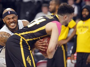 Halifax Hurricanes’ Tyrone Watson and London Lightning’s Ryan Anderson struggle for the ball  in Game 2 of the National Basketball League of Canada best-of-seven final Tuesday in Halifax. The Hurricanes won 100-91 to take a 2-0 series lead.
ERIC WYNNE/Chronicle Herald