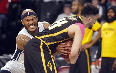 Halifax Hurricanes’ Tyrone Watson and London Lightning’s Ryan Anderson struggle for the ball  in Game 2 of the National Basketball League of Canada best-of-seven final Tuesday in Halifax. The Hurricanes won 100-91 to take a 2-0 series lead.
ERIC WYNNE/Chronicle Herald