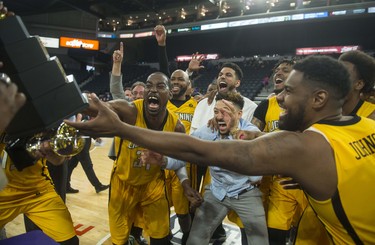 The London Lightning get ready to hoist the championship trophy after their 109-101 victory over the Halifax Hurricanes in Game 7 of the NBL Canada finals.
(RYAN TAPLIN / The Chronicle Herald)