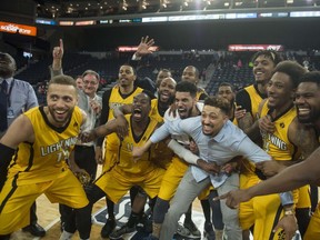 The London Lightning get ready to hoist the championship trophy after their 109-101 victory over the Halifax Hurricanes in Game 7 of the NBL Canada finals.
(RYAN TAPLIN / The Chronicle Herald)