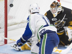 Swift Current Broncos forward Glenn Gawdin (15) fails to get his shot past Hamilton Bulldogs goalie Kaden Fulcher (33) of Brigden, Ont., during the third period in a Memorial Cup round-robin game in Regina on Monday, May 21, 2018. (JONATHAN HAYWARD/The Canadian Press)