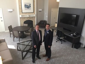Gerry Champagne, left, general manager of the Delta London Armouries and Dave Bartlam, director of sales and marketing, stand in the spacious Royal suite, one of 15 suites in the historic 1905 section of the hotel that has just undergone a $2-million renovation. (Hank Daniszewski/The London Free Press)