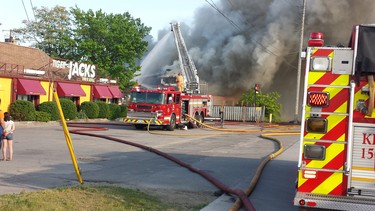 A fire in south London broke out Tuesday at the former Hooks restaurant, generating thick billows of smoke. (DAN BROWN, The London Free Press)