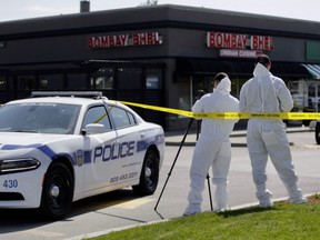 Peel police forensic officers at the scene of an explosion at Bombay Bhel Indian restaurant in Mississauga on Friday, May 25, 2018. (Ernest Doroszuk/Toronto Sun)