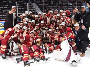 The Acadie-Bathurst Titan pose with the Memorial Cup as they celebrate defeating the Regina Pats in the Memorial Cup final in Regina on Sunday, May 27, 2018.