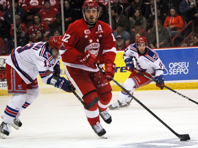 Sault Ste. Marie Greyhounds winger Boris Katchouk carries the puck, tailed by Kitchener Rangers centre Riley Damiani and watched by Rangers winger Nick McHugh, during first-period Ontario Hockey League Western Conference playoff action Monday, April 30, 2018 at Essar Centre in Sault Ste. Marie, Ont. JEFFREY OUGLER/SAULT STAR/POSTMEDIA NETWORK