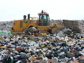 A tractor moves garbage at the City of London W12A landfill site in this file photo. (Free Press)