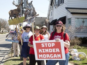 Approximately 40 people gathered outside the constituency office of MP Peter Fragiskatos  to demand not allow Kinder Morgan to built another oil pipeline from Alberta to British Columbia. (DEREK RUTTAN, The London Free Press)