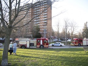 Firefighters, paramedics, and police responded to a fire at 85 Walnut St. shortly after 7 p.m. in London, on Tuesday. Fire fighters used an extension ladder to dowse the fire that was contained to a balcony. No one was injured in the incident. (DEREK RUTTAN, The London Free Press)