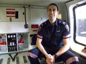 Fanshawe paramedic student Scott Bernaerts sits inside Fanshawe College’s newest training aid, a decommissioned Sikorski S-76A Ornge helicopter that will be used to train paramedics. (MIKE HENSEN, The London Free Press)