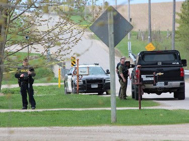 Ontario Provincial Police closed a section of Front Road between Huron Road and Fifth Line, north of Vanastra, as part of a suspicious death investigation on Friday. (DALE CARRUTHERS / THE LONDON FREE PRESS)