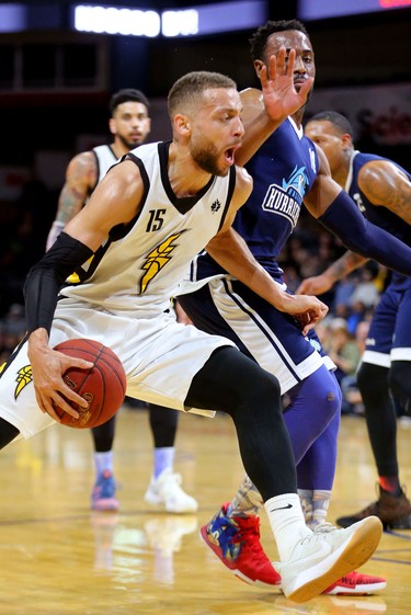 Garrett Williamson of the Lightning drives in on Antoine Mason of the Halifax Hurricanes during the first half of game four of the NBL finals at Budweiser Gardens in London, Ont. 
Photograph taken on Saturday May 12, 2018. 
Mike Hensen/The London Free Press/Postmedia Network
